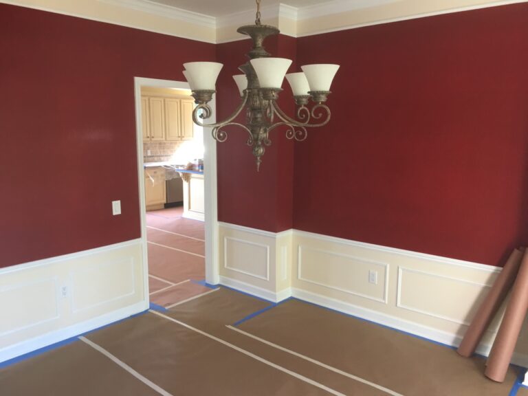 A room with red walls and white trim